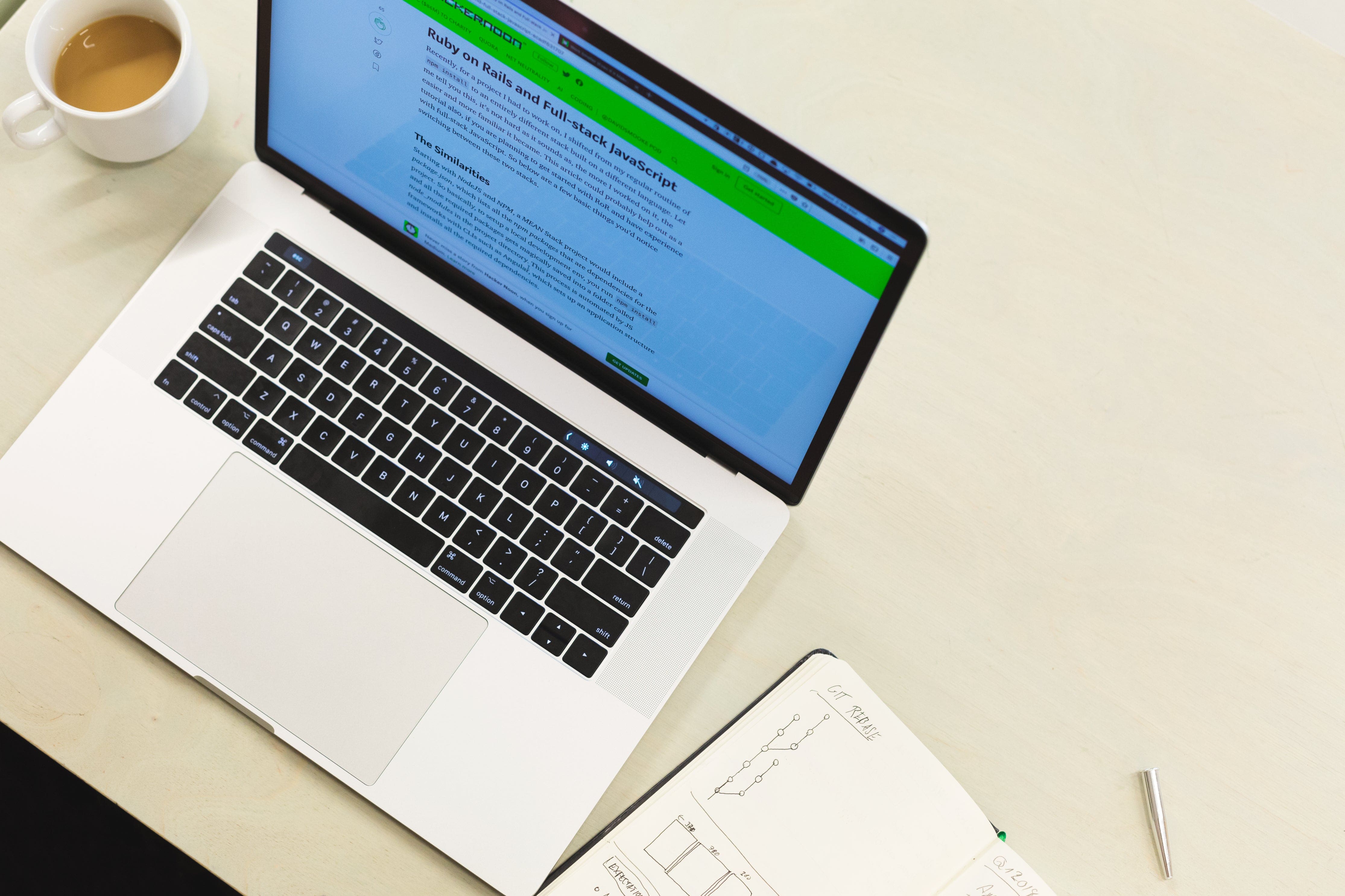 Person taking notes on their laptop